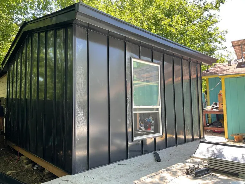 Black standing seam metal wall panels for Roof Inspection in Weslaco